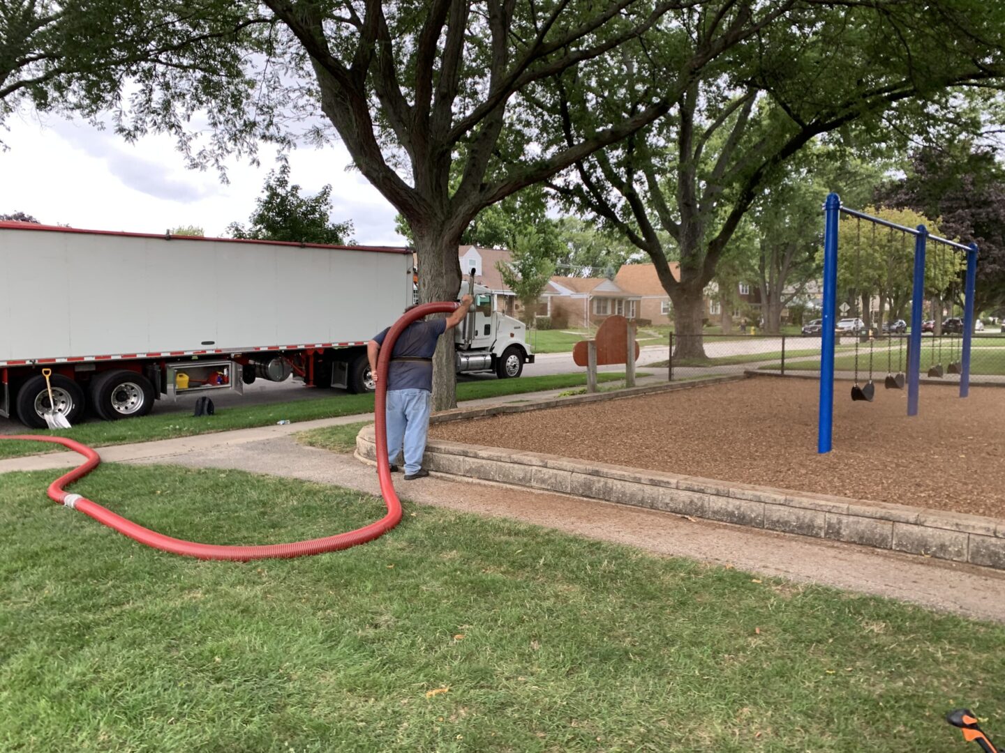 A man taking care of the play area’s grounds