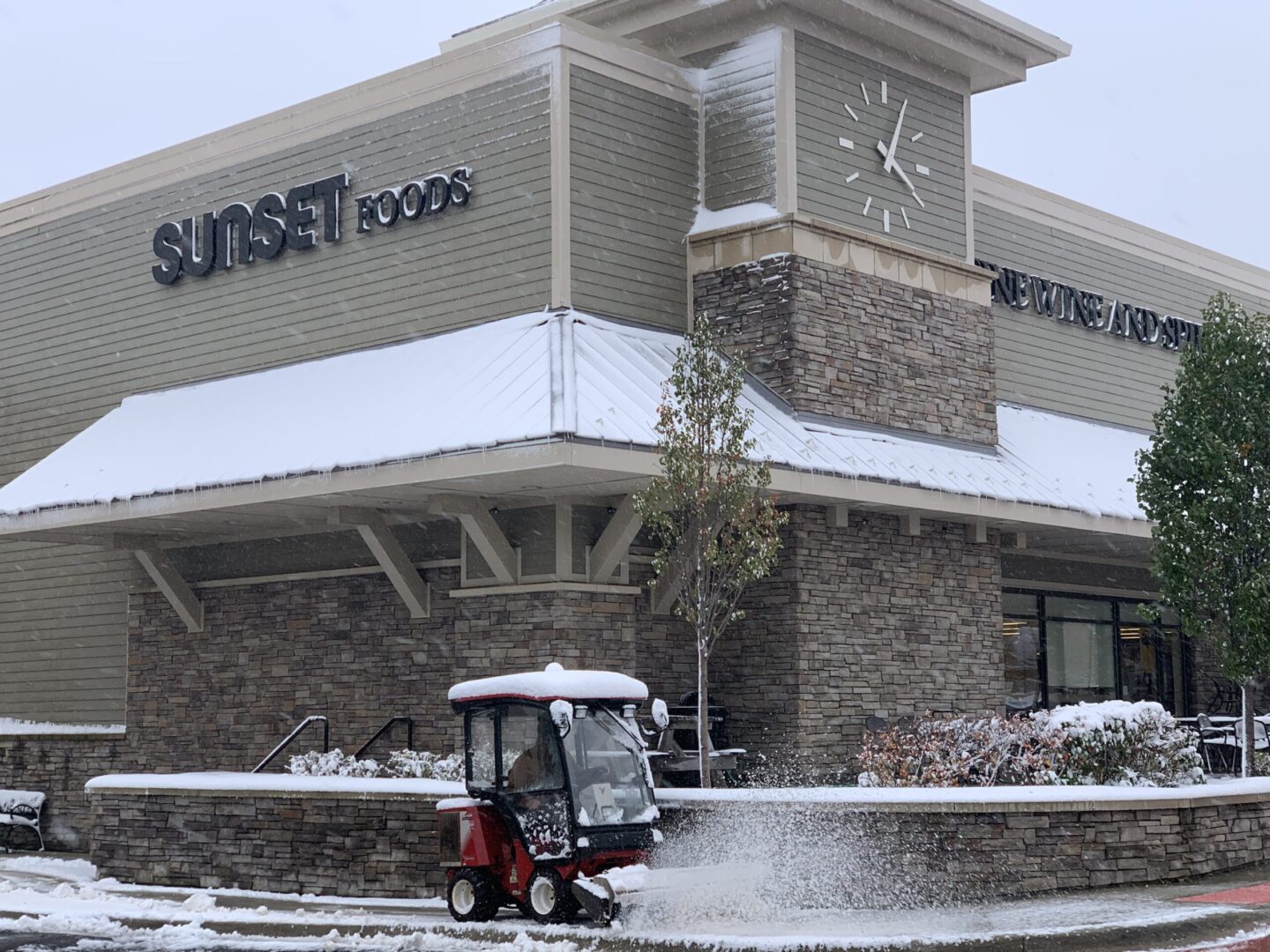 Sunset Foods building during snow